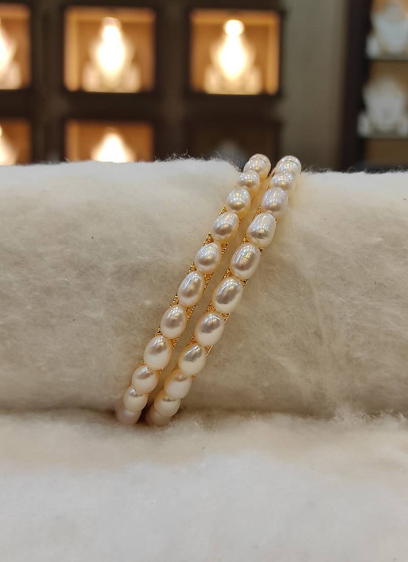 White pearl bangles-and-bracelets