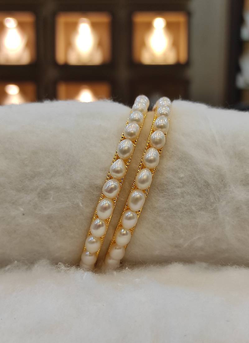 White pearl bangles-and-bracelets