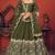 Shubhkala Mesmerizing Olive Green Thread And Sequins Embroidered Art Silk Party Wear Lehenga Choli