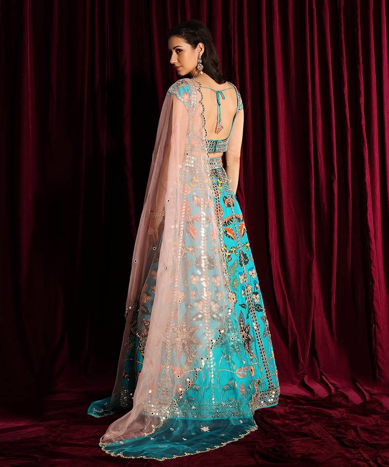 Turquoise Heavy Embroidered Lehenga Blouse With A Dupatta
