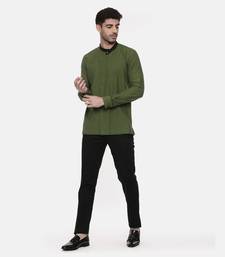 green malai cotton short kurta with contrast black collar. pair with denims or linen pants.