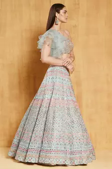 turquoise sequins, zari, and thread embroidered with foil mirror organza semi stitched lehenga