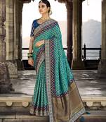 Turquoise woven silk saree with blouse