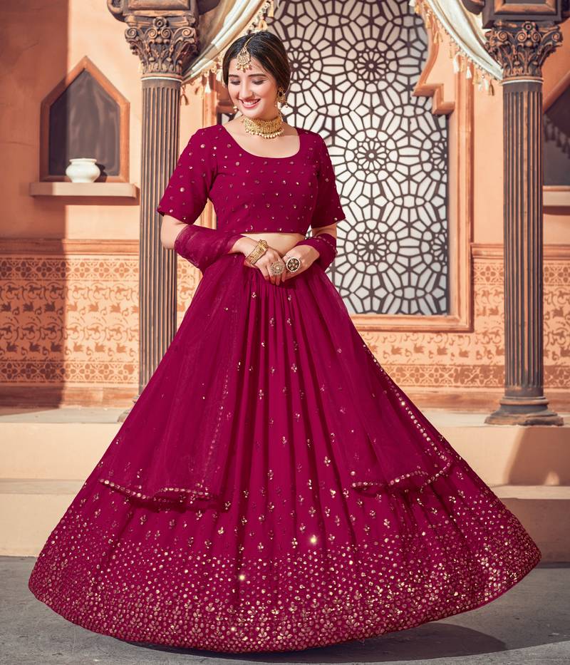 Shubhkala Eye Catching Deep Pink Thread And Sequins Embroidered Georgette Wedding Lehenga