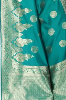 Green woven Banarasi silk blend saree with blouse
