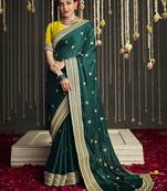 Dark green embroidered pure silk saree with blouse