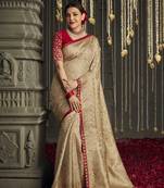 Beige embroidered pure silk saree with blouse