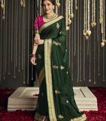Dark green embroidered pure silk saree with blouse