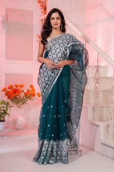 Uniqueness will ooze out from your look in this teal resham silk handwoven saree.