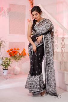 Look enchanting and charming in this black resham silk handwoven saree. It has small motifs embroidered all over.