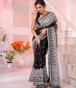 Look enchanting and charming in this black resham silk handwoven saree. It has small motifs embroidered all over.