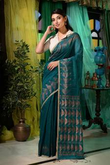 Woven with royalty and utmost intricacy, this teal matka silk saree will elevate you whole look.