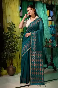 Woven with royalty and utmost intricacy, this teal matka silk saree will elevate you whole look.