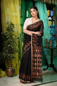 Bold and enchanting is what you will look in this black matka handwoven saree.