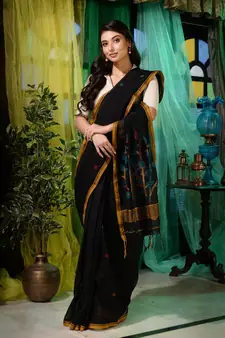 You are sure to look confident and glamorous in this black cotton handwoven saree. It has small motifs woven all over.