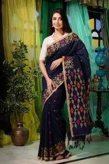 Look dainty and charming in this navy blue linen handwoven saree. It has small motifs woven all over.