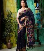 Look dainty and charming in this navy blue linen handwoven saree. It has small motifs woven all over.