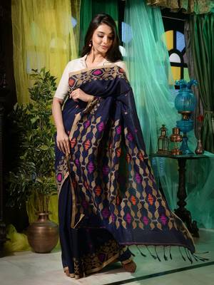 Look dainty and charming in this navy blue linen handwoven saree. It has small motifs woven all over. 2