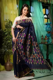 Look dainty and charming in this navy blue linen handwoven saree. It has small motifs woven all over.