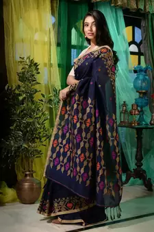 Look dainty and charming in this navy blue linen handwoven saree. It has small motifs woven all over.