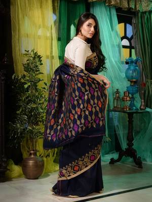 Look dainty and charming in this navy blue linen handwoven saree. It has small motifs woven all over. 4