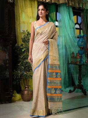 Ethnic patterns with modern colour combinations are reflected in this beige cotton hand spun handwoven saree. 2