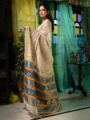 Ethnic patterns with modern colour combinations are reflected in this beige cotton hand spun handwoven saree. 3