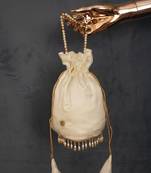 Off White colour Silk (Paithani) Pearl lace border also comes with moti handle potli purse