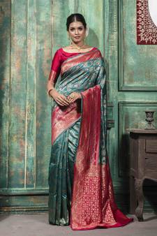Sea green woven Banarasi silk blend saree with blouse
