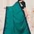 Dark green embroidered silk saree with blouse