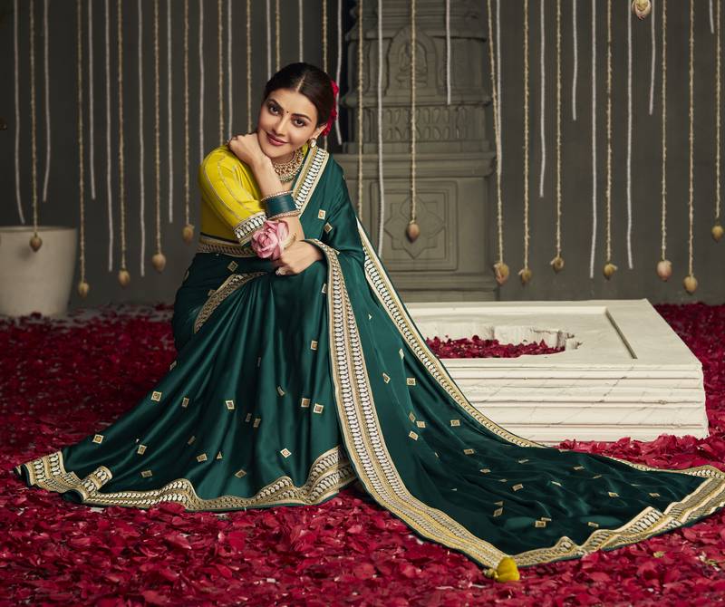 Dark green embroidered pure silk saree with blouse