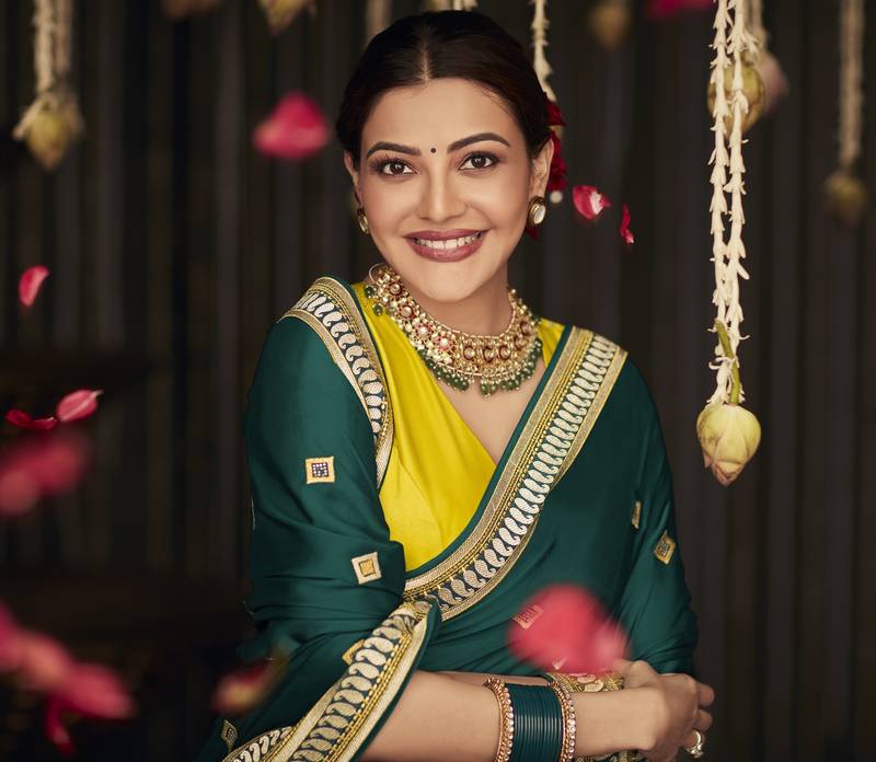 Dark green embroidered pure silk saree with blouse