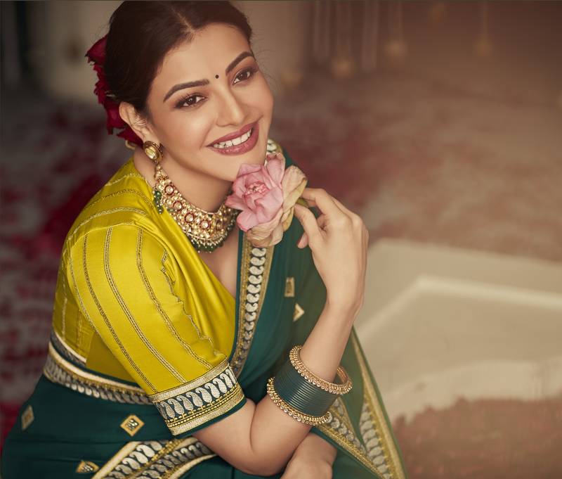 Dark green embroidered pure silk saree with blouse