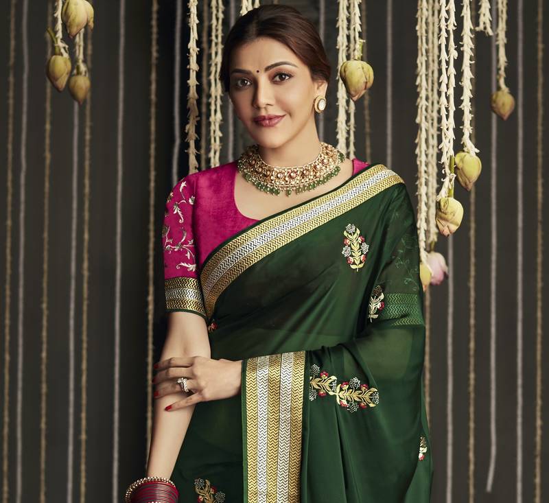 Dark green embroidered pure silk saree with blouse
