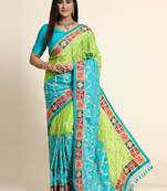 Green embroidered silk blend saree with blouse