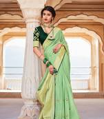 Light green woven silk saree with blouse