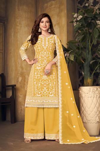 Yellow embroidered net salwar kameez