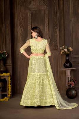 Yellow embroidered net semi stitched lehenga 5
