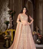 Peach embroidered net semi stitched lehenga