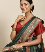 Green woven banarasi silk saree with blouse