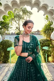 Green Sequins Embroidered Soft Net Wedding Wear Lehenga Choli