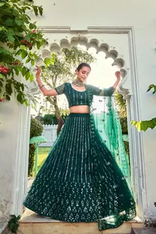 Green Sequins Embroidered Soft Net Wedding Wear Lehenga Choli
