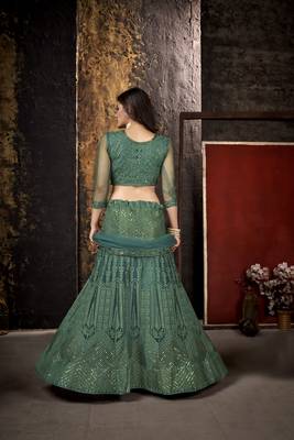 Green embroidered net  lehenga 5