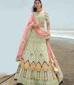 Enchanting Pista green dori, zarkan and thread embroidered georgette semi stitched wedding lehenga