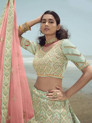 Enchanting Pista green dori, zarkan and thread embroidered georgette semi stitched wedding lehenga 4