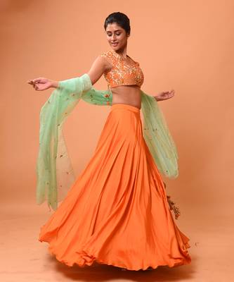 Bright Orange Lehenga With Intricate Handwork  2