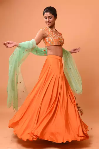 Bright Orange Lehenga With Intricate Handwork 