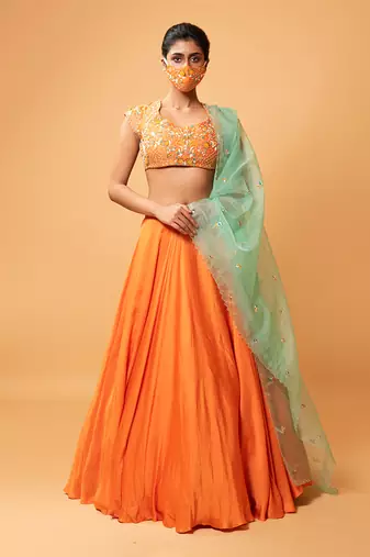 Bright Orange Lehenga With Intricate Handwork 
