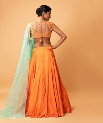 Bright Orange Lehenga With Intricate Handwork  4