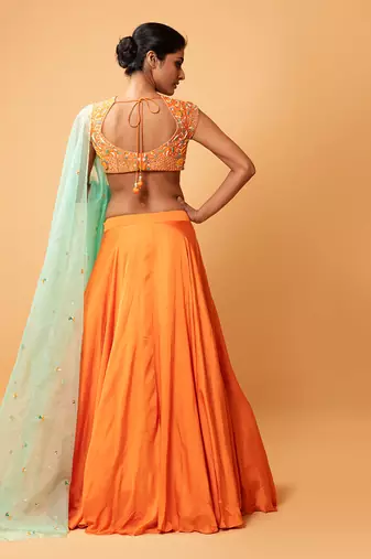 Bright Orange Lehenga With Intricate Handwork 
